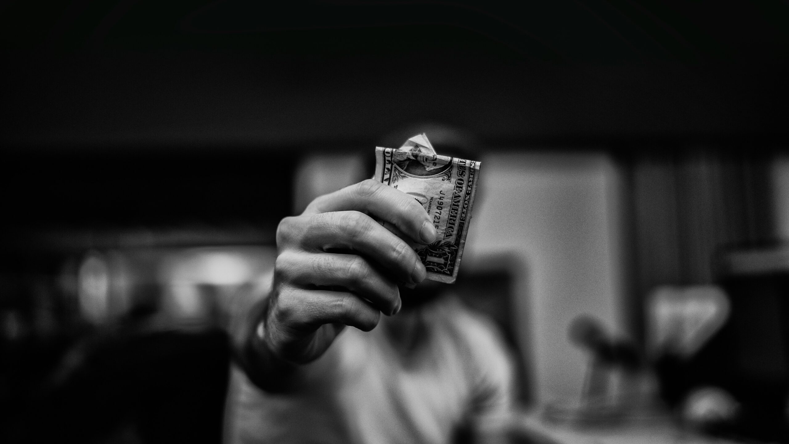 Customer withdrawing cash from an ATM inside a Washington, DC convenience store